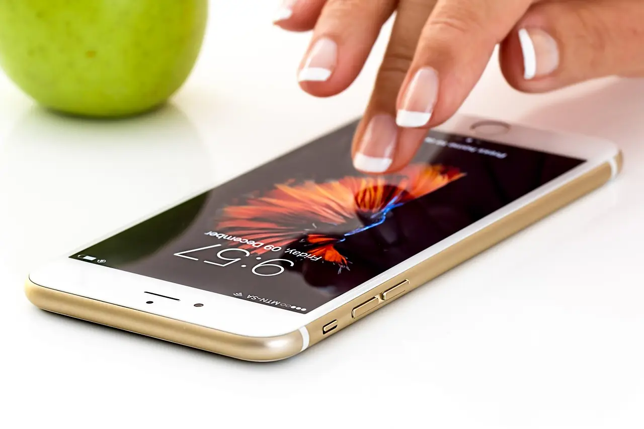 Finger tapping the screen of a smartphone