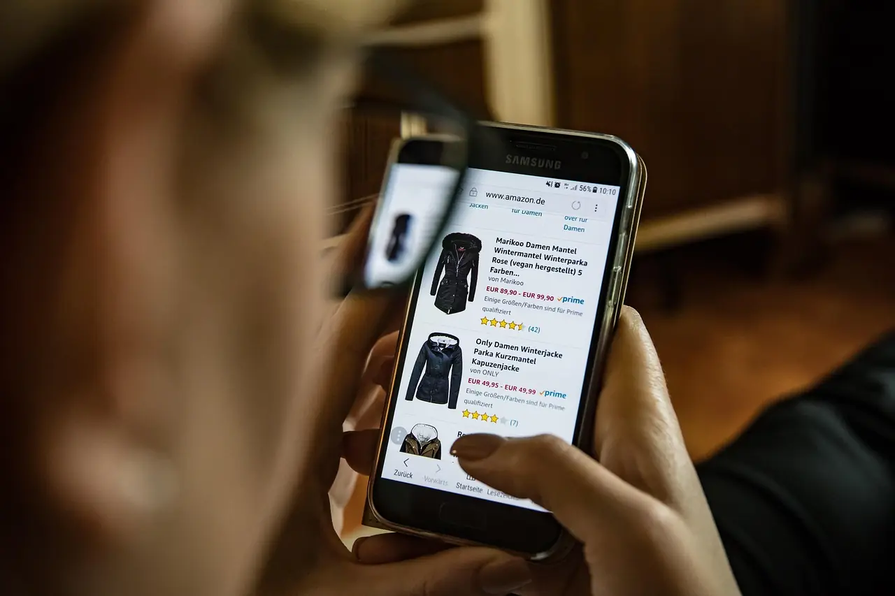 Person browsing an online clothing store on a smartphone
